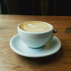 Close-up of cappuccino on table