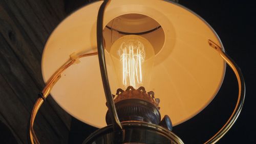 Low angle view of illuminated light bulb