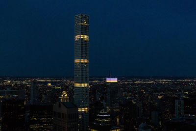 Illuminated buildings in city at night