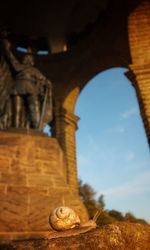 Low angle view of electric fan against sky