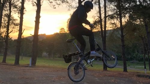 Man riding bicycle on field