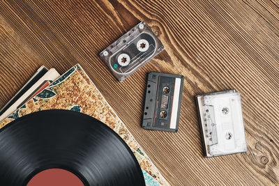 Vinyl records, cassette tapes and recorder. retro music style. 80s music party. back to the past