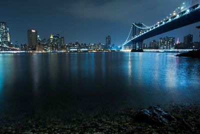 Illuminated city at waterfront