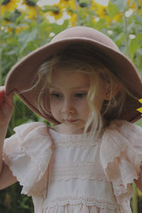 Portrait of young woman wearing hat