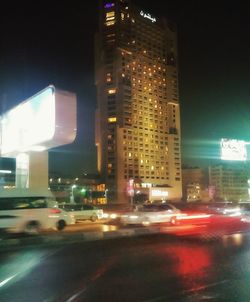 Traffic on road in city at night