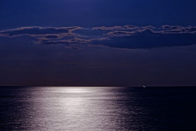 Scenic view of sea against sky at night