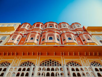 Low angle view of building against clear blue sky