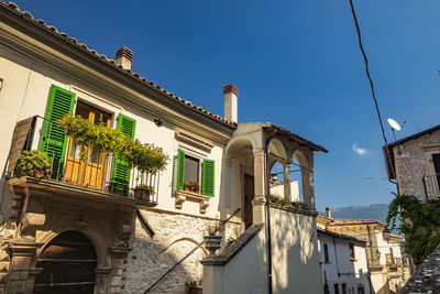 Low angle view of building against blue sky