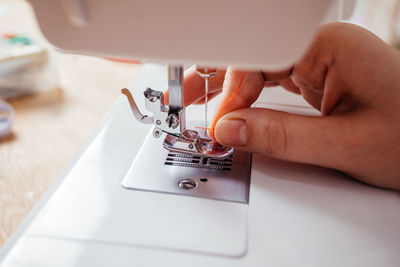 Close-up of hand holding machine