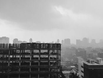 High angle view of buildings in city against sky