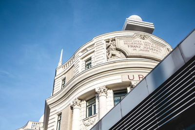 Low angle view of building against blue sky