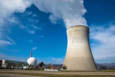 Smoke stacks against sky