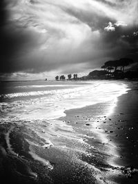 Scenic view of sea against cloudy sky