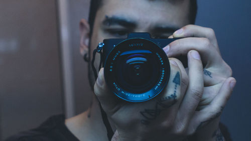 Close-up of hand holding camera