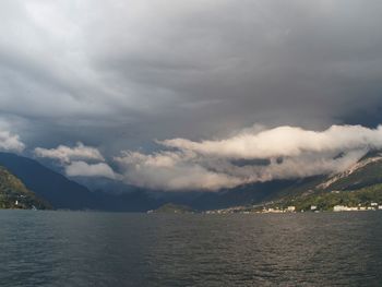 View of calm lake against mountain range