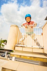 Portrait of boy playing with toy car