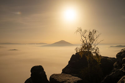 Scenic view of silhouette mountain against sky during sunset