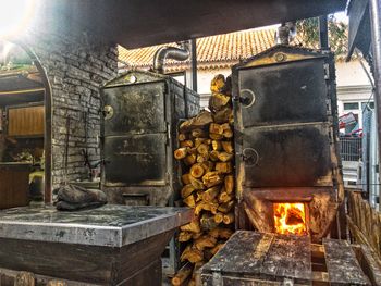 Stack of firewood against built structure