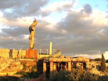 Statue against sky during sunset