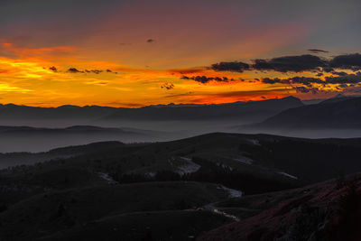 Scenic view of dramatic sky during sunset