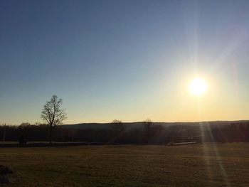 Scenic view of landscape against sky at sunset