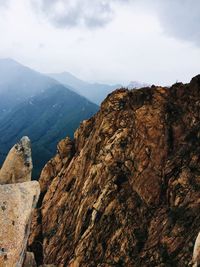 Rock formations on landscape against sky