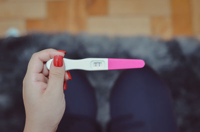 Close-up of woman holding hands