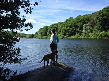 Woman relaxing in nature with her dog