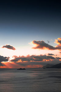 Scenic view of sea against romantic sky at sunset