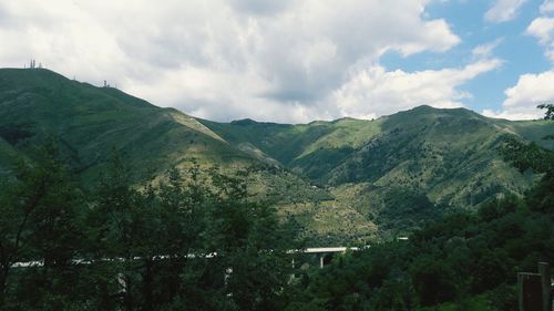 Scenic view of landscape and mountains against sky