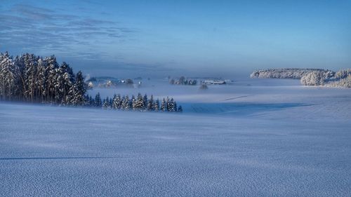 Scenic view of sea against sky during winter