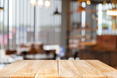 Close-up of illuminated pendant light on table in restaurant