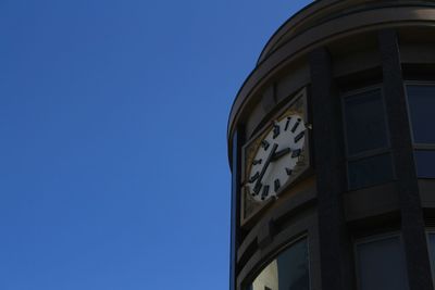 Low angle view of built structure against clear blue sky