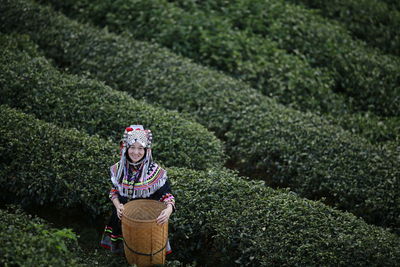 Portrait of farmer in traditional clothing working at farm