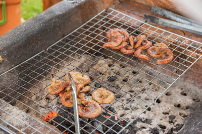 High angle view of food on barbecue grill