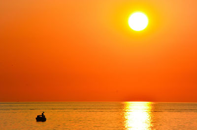 Scenic view of sea at sunset