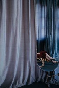 Low section of woman reflecting on mirror in room