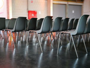 Empty chairs and table in room