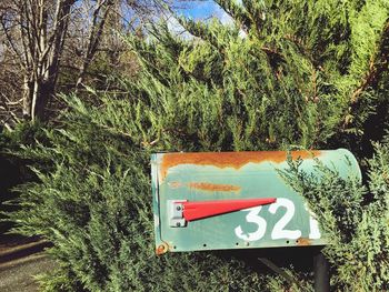 Information sign against trees