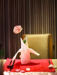 Close-up of pink roses on table