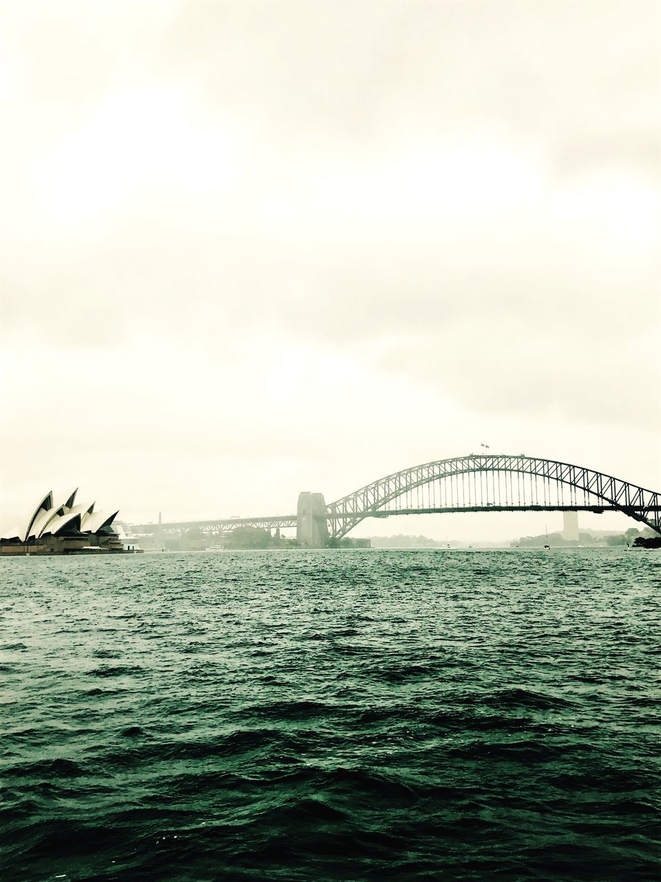 water, sea, built structure, architecture, sky, outdoors, travel destinations, waterfront, nature, no people, building exterior, day, bridge - man made structure, beauty in nature