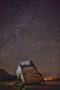 Abandoned building against sky at night