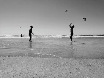 People playing on beach