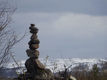 Stack of rocks against sky