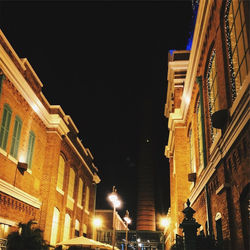 Low angle view of illuminated buildings at night