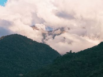 Scenic view of landscape against cloudy sky
