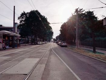 View of street in city against sky