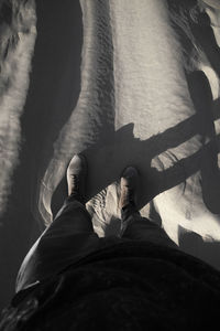 Low section of man lying on floor