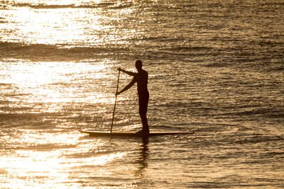 Silhouette of man standing on beach