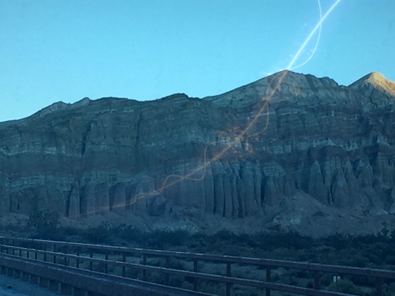 mountain, mountain range, clear sky, blue, tranquil scene, scenics, tranquility, beauty in nature, landscape, rock formation, rocky mountains, nature, physical geography, geology, non-urban scene, rock - object, copy space, sky, sunlight, low angle view